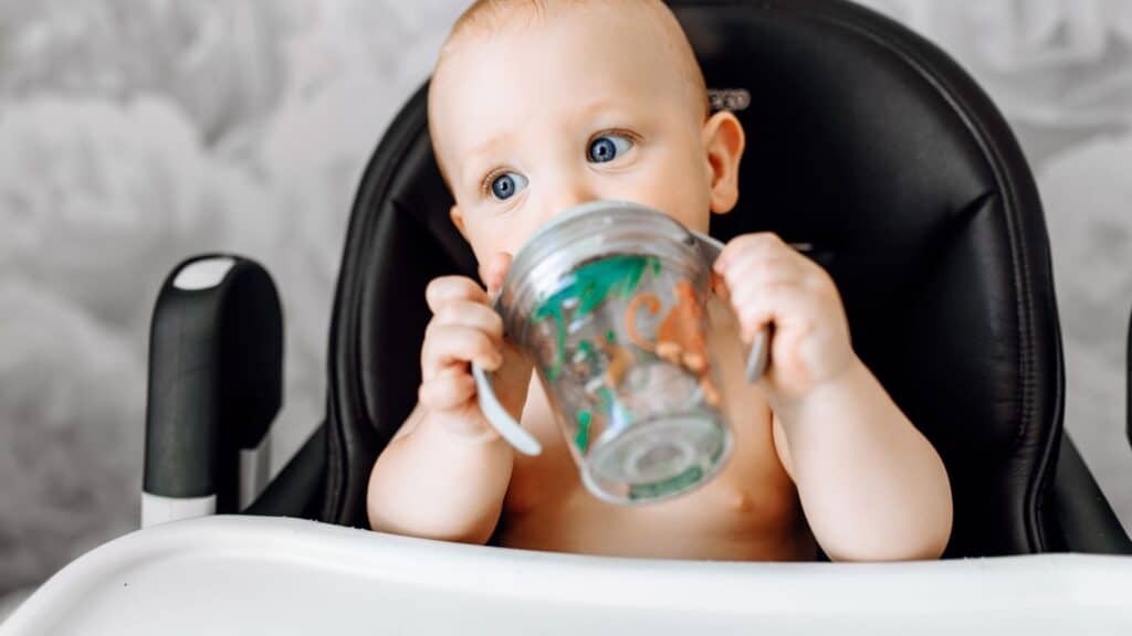 baby drinking in bottled water