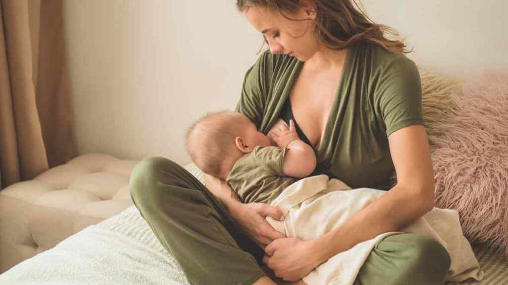 Breastfeed her infant.