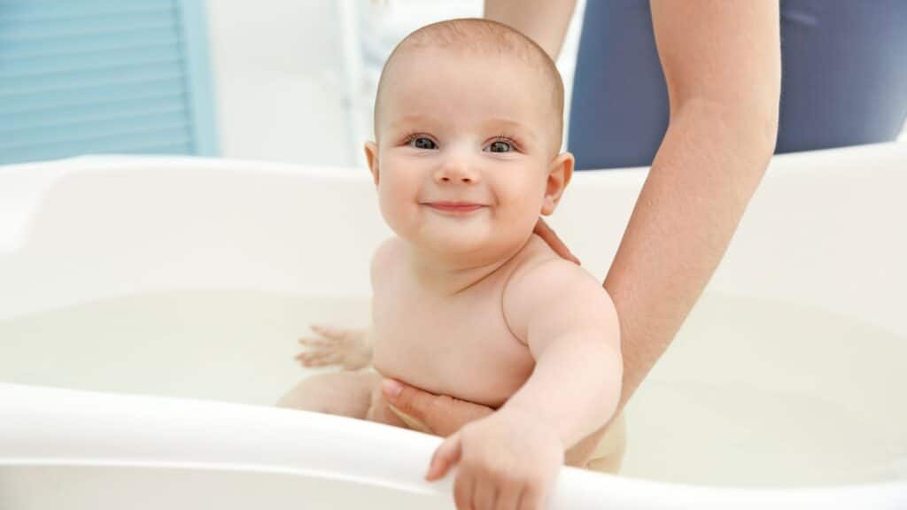 Infant bathing in the tub.