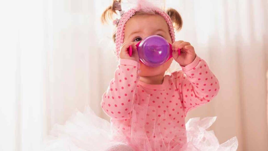 baby drinking in sippy cup