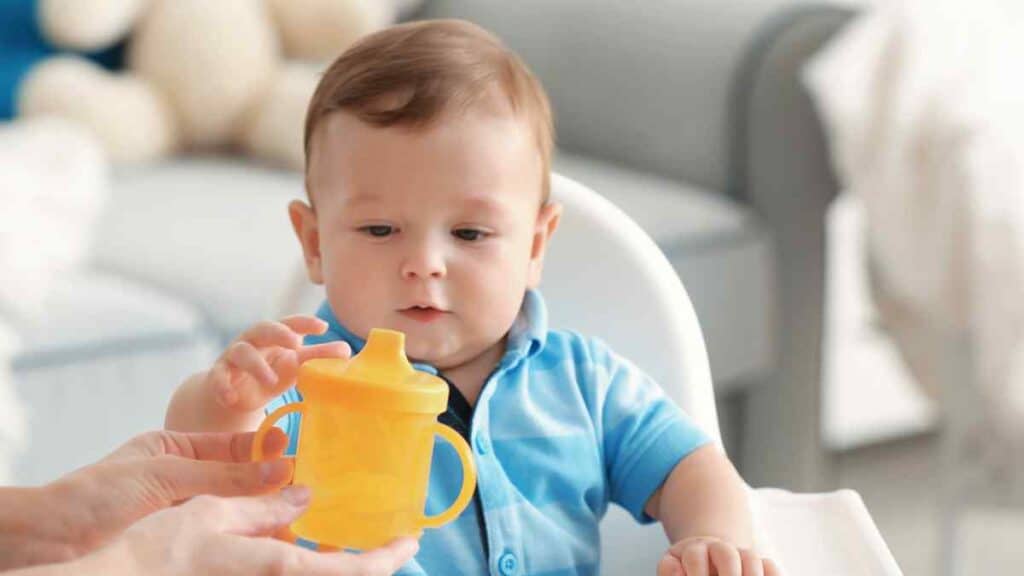 baby and the yellow sippy cup