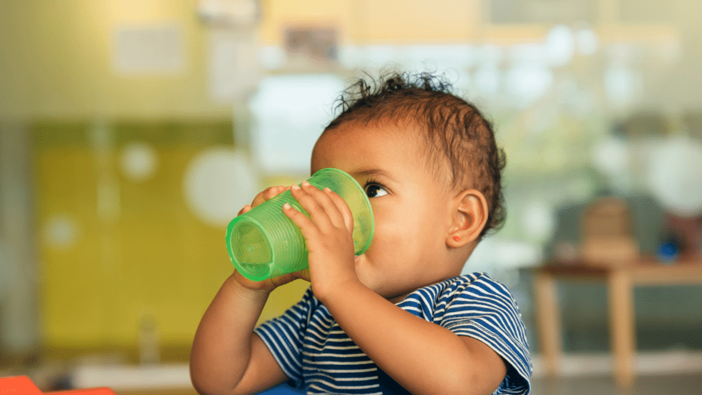 Using green sippy cup